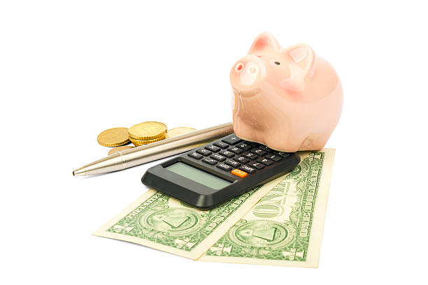 istock Piggy bank with coins and pen 501001968