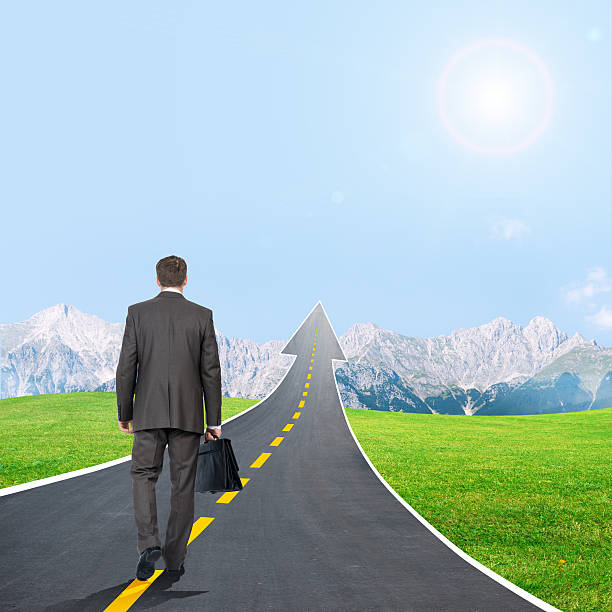 istock Man walking on highway road going up as an arrow 501002618