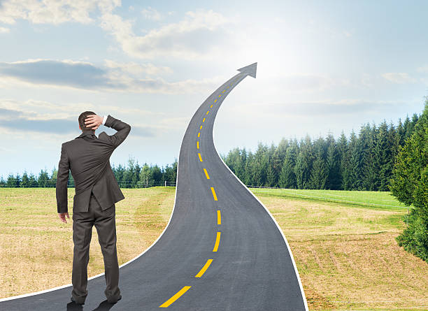 istock Person standing on roadway going up as arrow 501002658