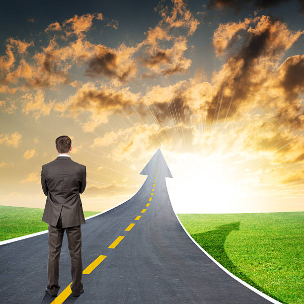 istock Man standing on roadway going up as arrow 501002680