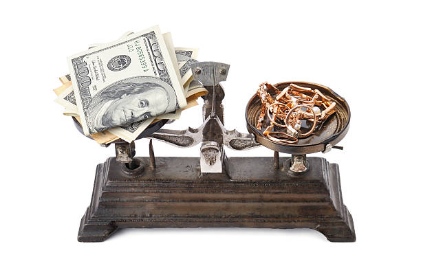 istock scales, money and gold 501002942