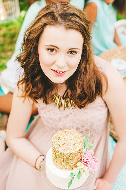 istock Pretty young woman with a beautiful cake 501023645