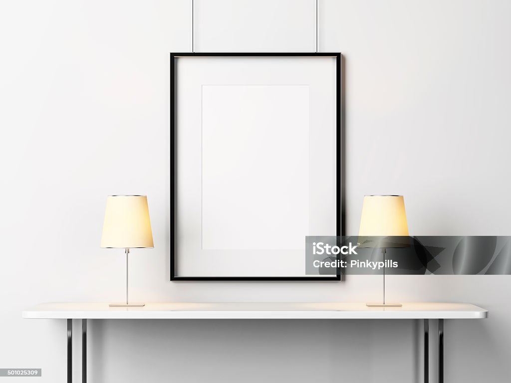 White table with lamps and blank picture frame Abstract Stock Photo