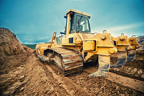 istock close-up of bulldozer or excavator working with soil on highway 501026897