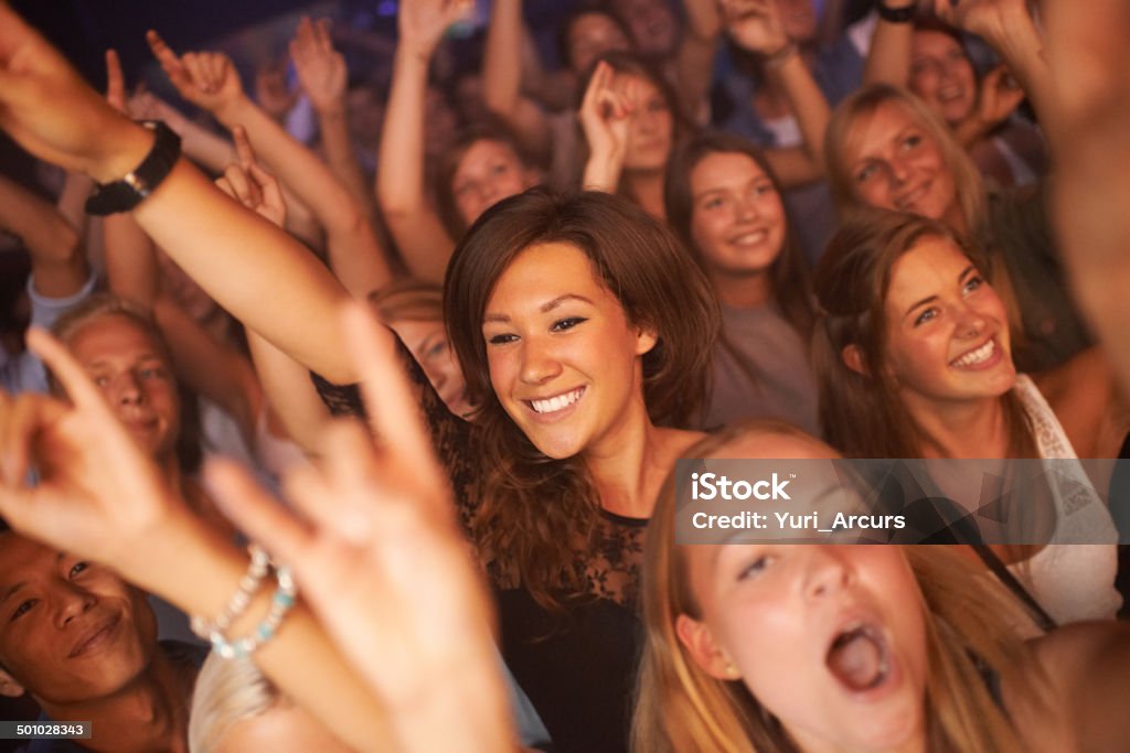 Singing every word to the song! Attractive female fans enjoying a concert- This concert was created for the sole purpose of this photo shoot, featuring 300 models and 3 live bands. All people in this shoot are model releasedhttp://195.154.178.81/DATA/i_collage/pi/shoots/782972.jpg 20-29 Years Stock Photo
