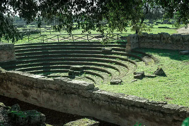 view of theater greek Paestum Italy, in the foreground the stone steps and the scenes