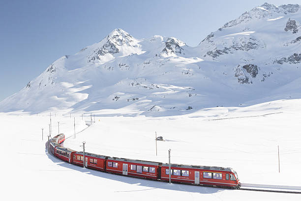 Swiss railway Swiss train with mountain in background engadine stock pictures, royalty-free photos & images