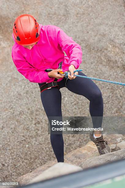 Fit Girl Abseiling Down Rock Face Stock Photo - Download Image Now - 20-29 Years, Active Lifestyle, Activity