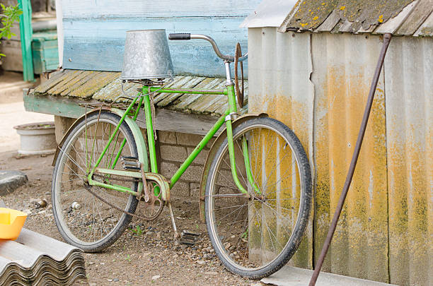 istock Old bicycle with a bucket on the saddle 501033872