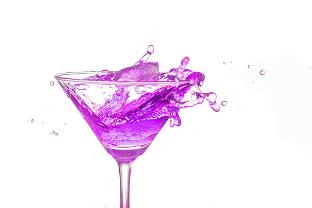 istock Purple cocktail splash on white background close up 501034944