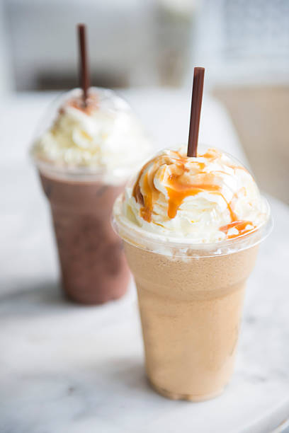 istock ice chocolate and caramel frappe in the takeaway plastic cup 501036982