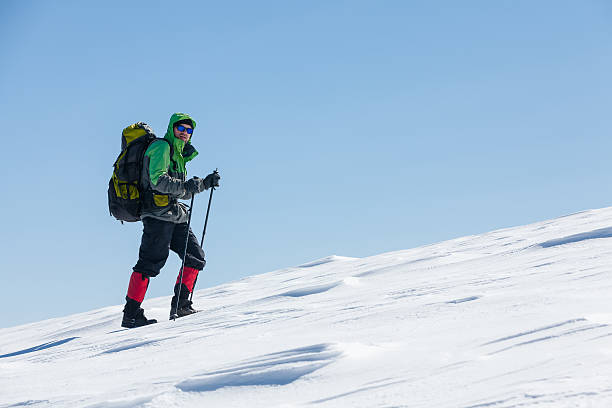istock Hiker in winter mountains on sunny day 501040280