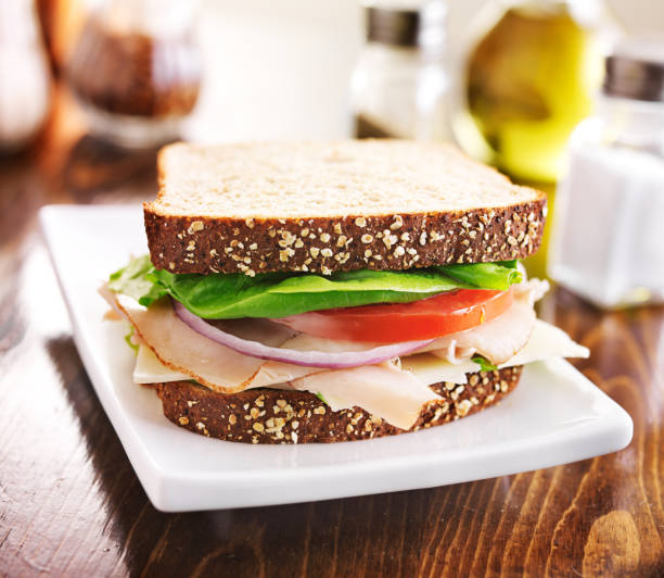 istock deli meat sandwich with turkey, tomato, onion, and lettuce 501040885