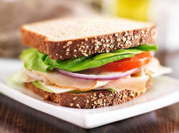 istock deli meat sandwich with turkey, tomato, onion, and lettuce 501040887
