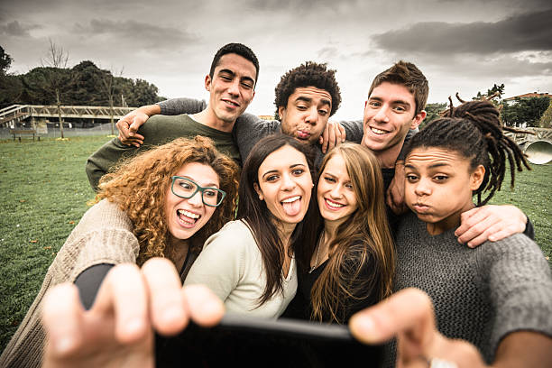 istock Group of college student laughing and doing a selfie 501041188