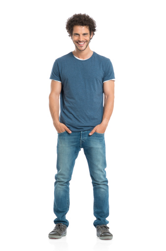 Portrait Of Happy Young Man With Hands In Pocket Standing Isolated On White Background