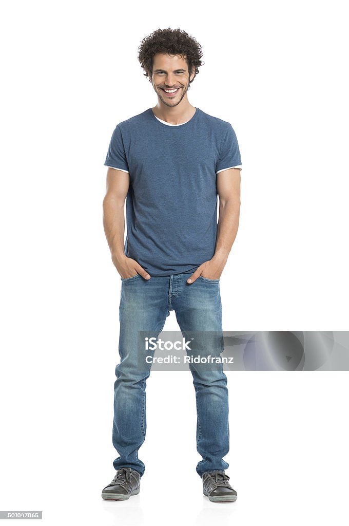 Portrait Of Smiling Young Man Portrait Of Happy Young Man With Hands In Pocket Standing Isolated On White Background Men Stock Photo