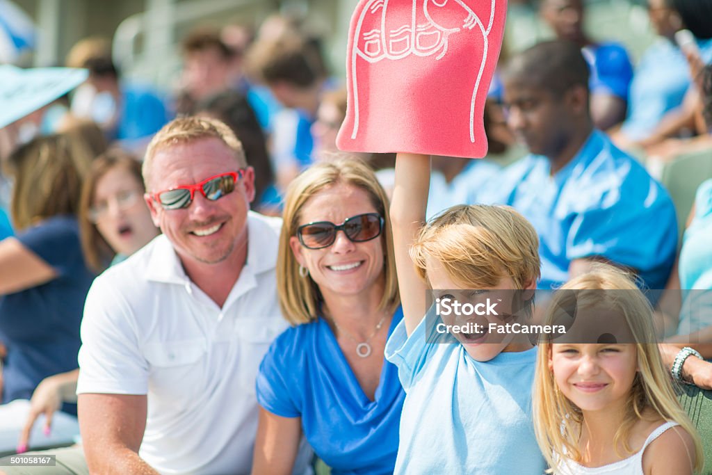 Family at the game Family together watching a sporting event. Family Stock Photo