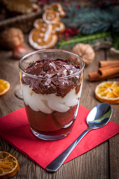 istock Layered dessert in a glass on a wooden table. 501058312