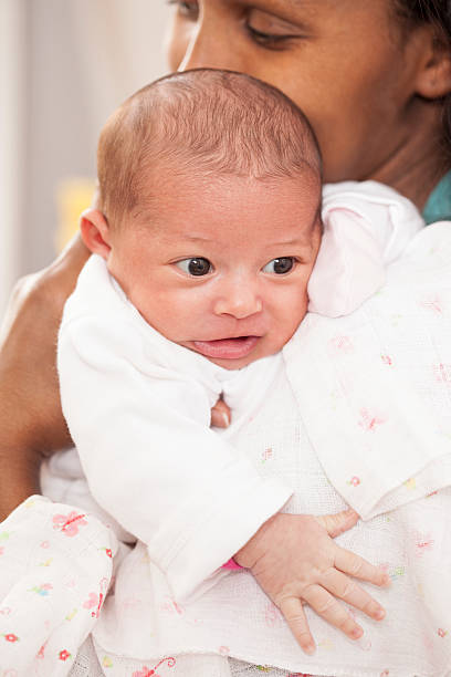 istock Newborn in mother's arms. 501059246