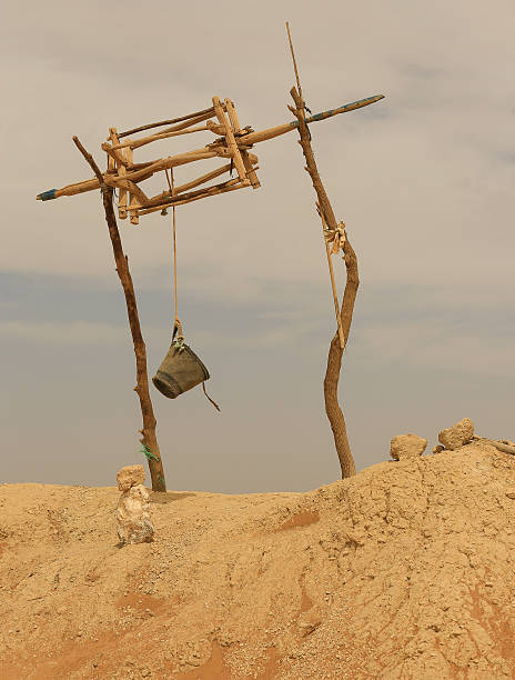istock Bucket hanging on a line over a  Moroccan well 501059453
