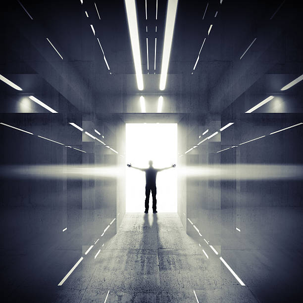 istock Abstract dark interior with lights, glowing door and man silhoue 501060497