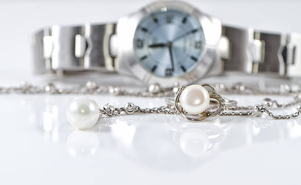istock Silver ring and chain on the background of watches 501061336