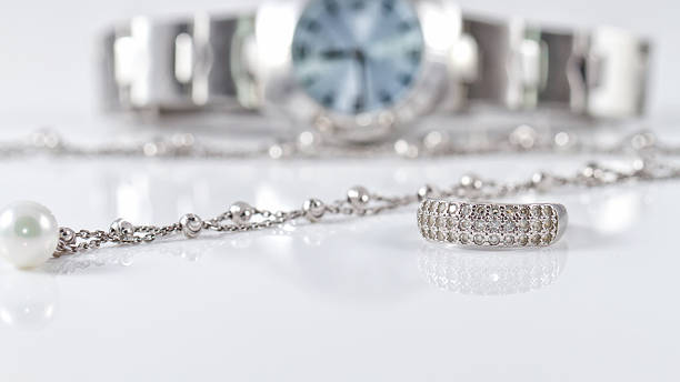 istock Silver ring and chain on the background of watches 501061380