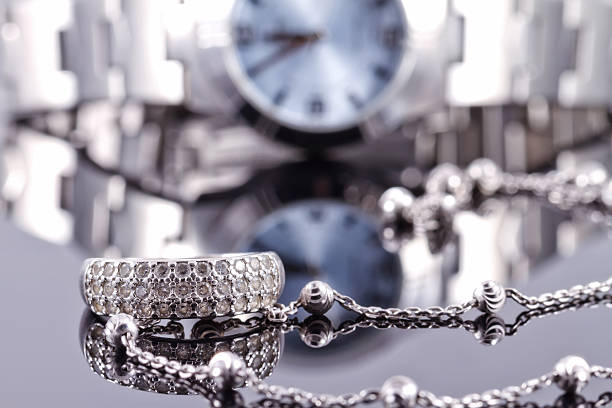 istock Silver ring and chain on the background of watches 501061450