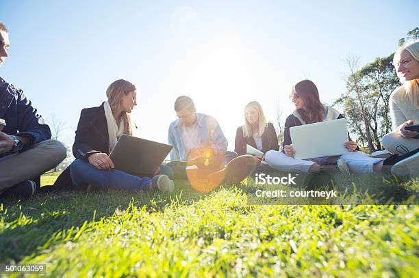 Group Of Young People Using Technology Stock Photo - Download Image Now - Group Of People, Outdoors, City Life