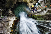 Rappeling down the waterfall