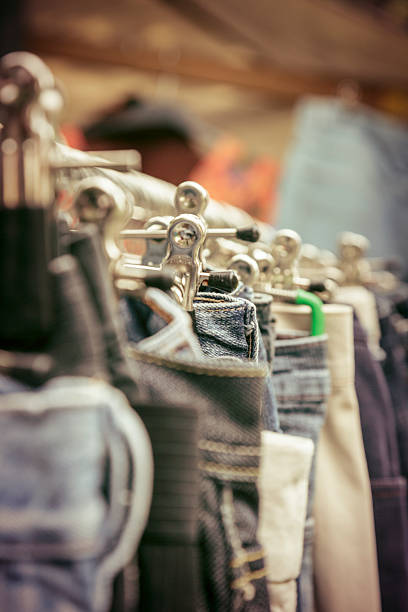 istock clothes on a rack on a flea market 501063817