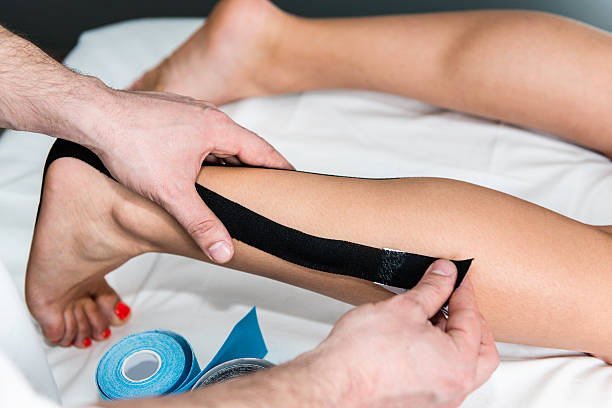 istock Placing kinesio taping on foot 501064137