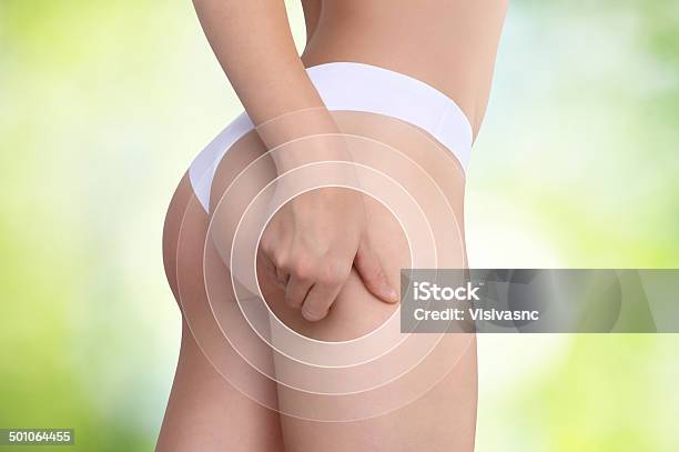 Woman Pinches Her Thigh To Control Cellulite Stock Photo - Download Image Now - Adipose Cell, Adult, Beauty