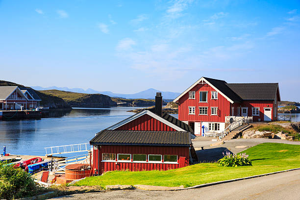 istock Sea cliffs and houses on the sea in Norway 501065002