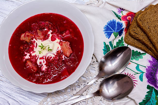 istock Beetroot soup, spoon, napkin on wooden background 501065340
