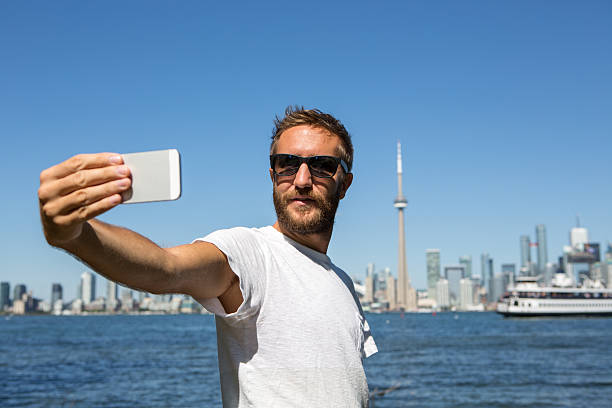 istock Tourist in Toronto-Canada taking a selfie portrait 501066014