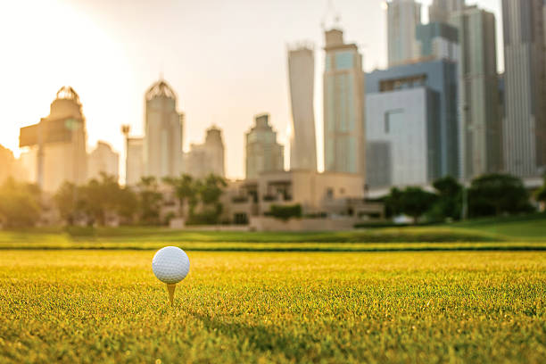 istock Playing golf at sunset. Golf ball is on the tee 501066162