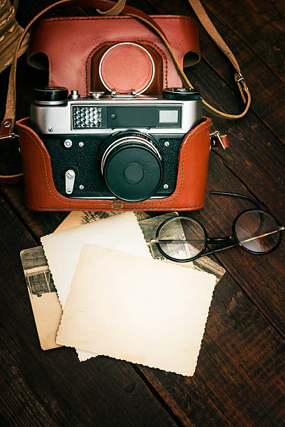 istock retro still camera and some old photos 501067984