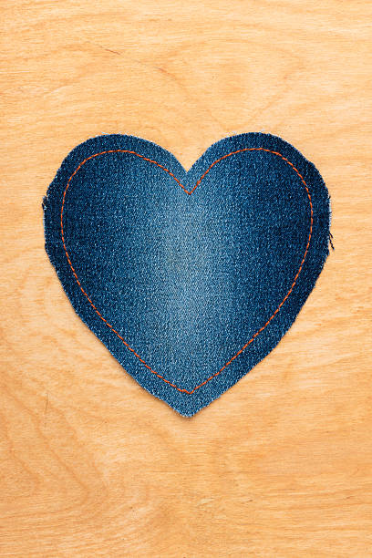 istock Jeans heart on wooden background 501069776
