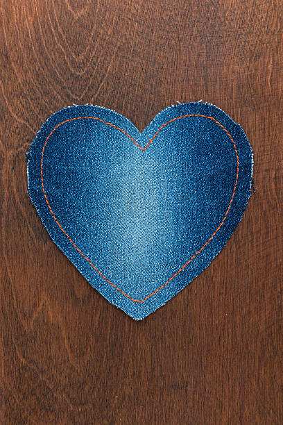 istock Jeans heart on wooden background 501069808