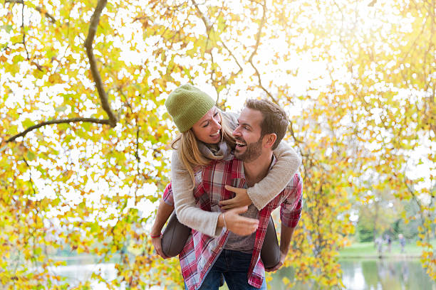 Young couple dating in park stock photo