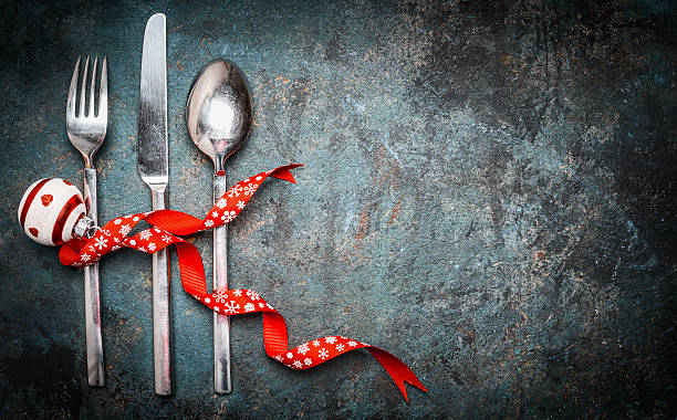 istock Christmas background with place setting silverware and red decoration 501072478