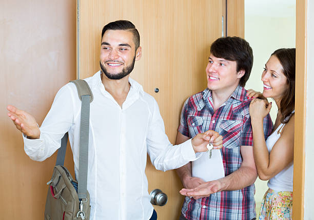 istock Couple with agent looking round new apartment 501084278