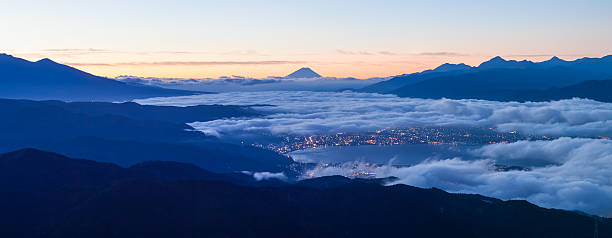 Beautiful sunrise view of Mountain Fuji and Suwa lake Beautiful sunrise view of Mountain Fuji and Suwa lake with cloud at Nagano prefecture in autumn season suwa lake photos stock pictures, royalty-free photos & images