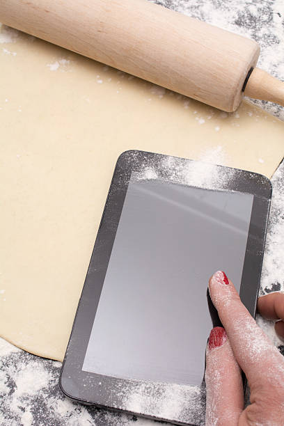 istock messy tablet with flour on black counter rolled out dough 501085552