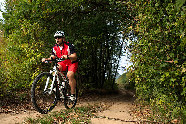 istock Biker on the forest road riding outdoor 501086792