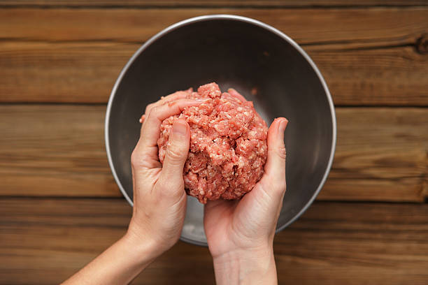 istock Raw mince meat in woman's hands 501087122