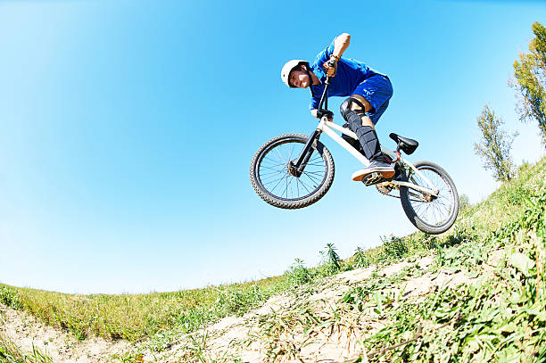 istock cyclist riding jumping with bicycle cross-country 501088672