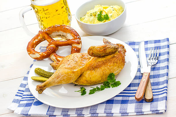 istock Half roast chicken, beer, pretzel and potato 501088930